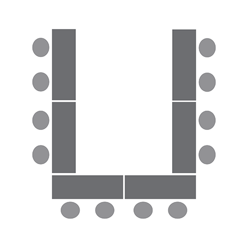 Diagram of four tables in a horseshoe with chairs on the outside