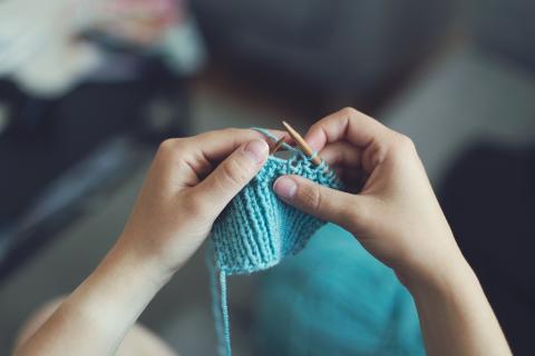 Image of hands knitting.