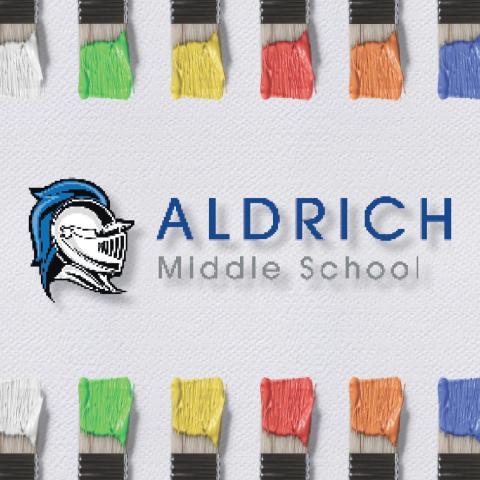 Colored paint brushes with Aldrich logo in the middle