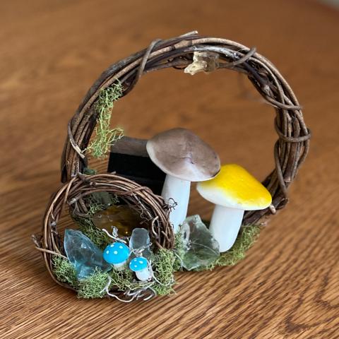 Large and small wreaths on wooden table