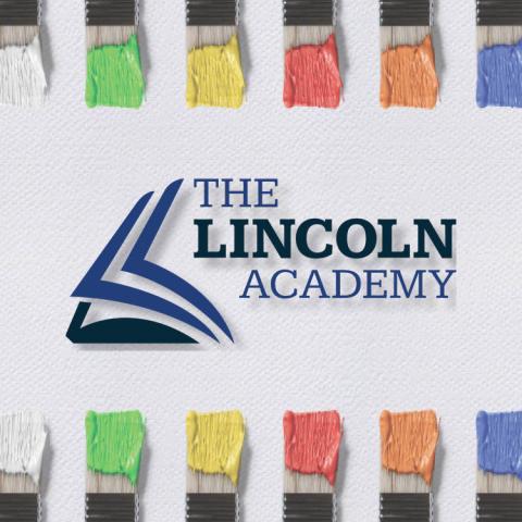 School logo with colorful paintbrush border