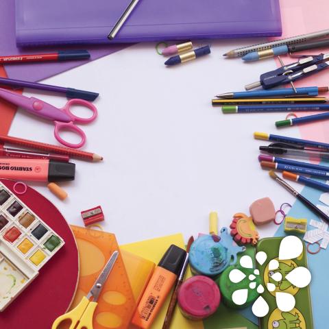 Different crafting supplies like pencils, scissors, paint, paint brushes, erasers, pencil sharpener, highlighters, and protractor. 