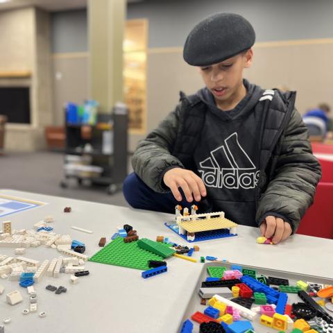 Child playing with legos.