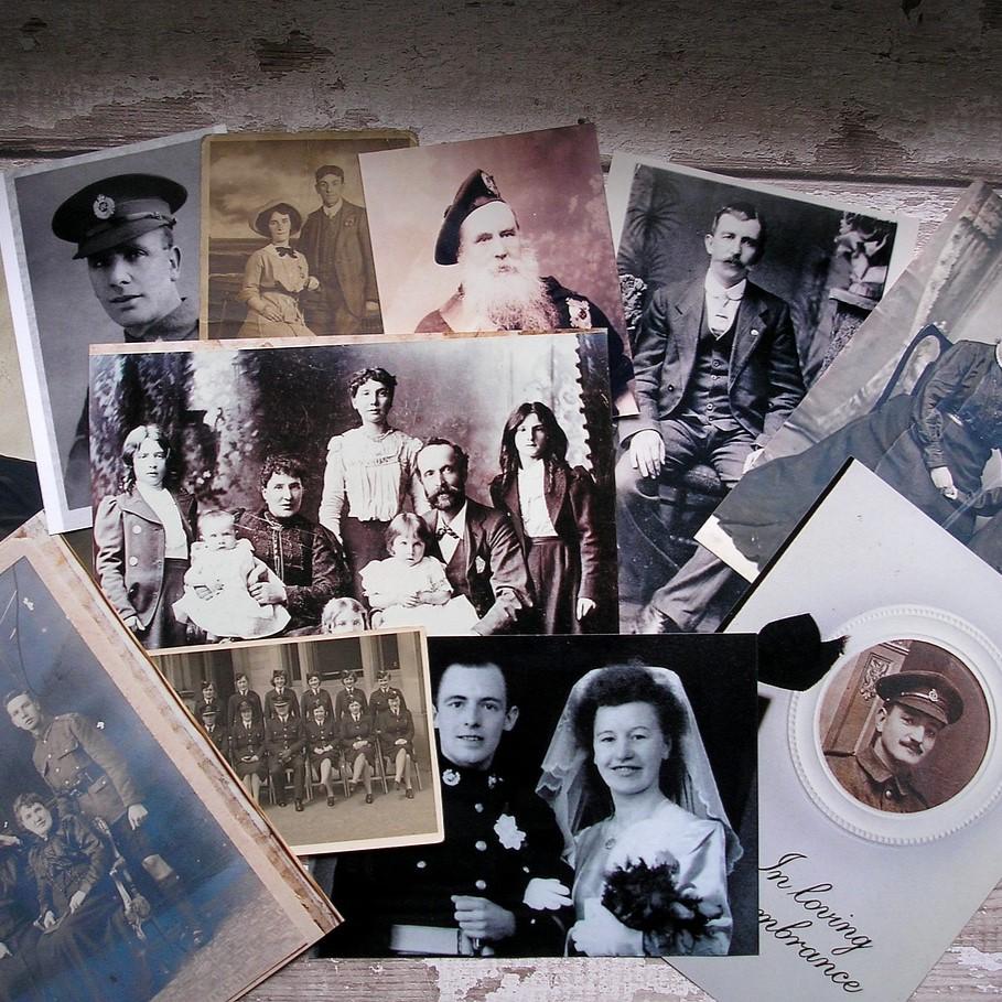 Old black and white photographs on a table