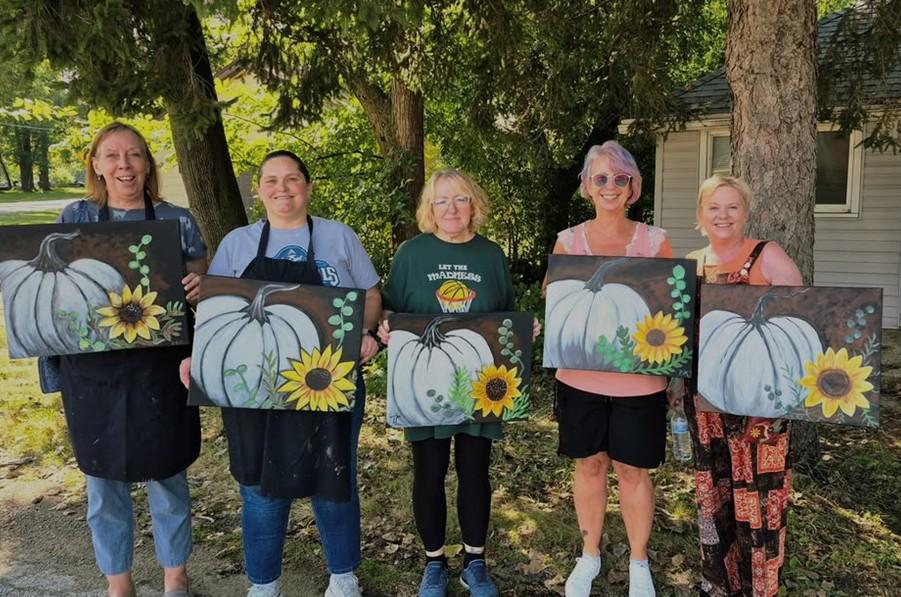 Art-Vark - 5 people holding artwork