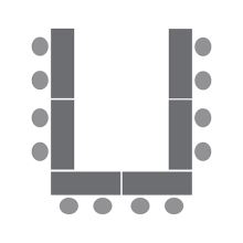 Diagram of four tables in a horseshoe with chairs on the outside