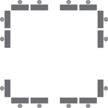 Diagram representing rectangular tables each with one chair situated around the exterior